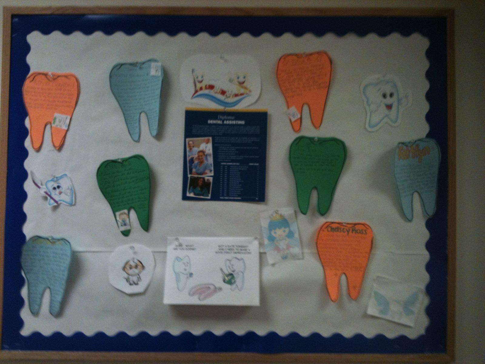 Bulletin board celebrating student achievements in Marina Davar's dental assisting program