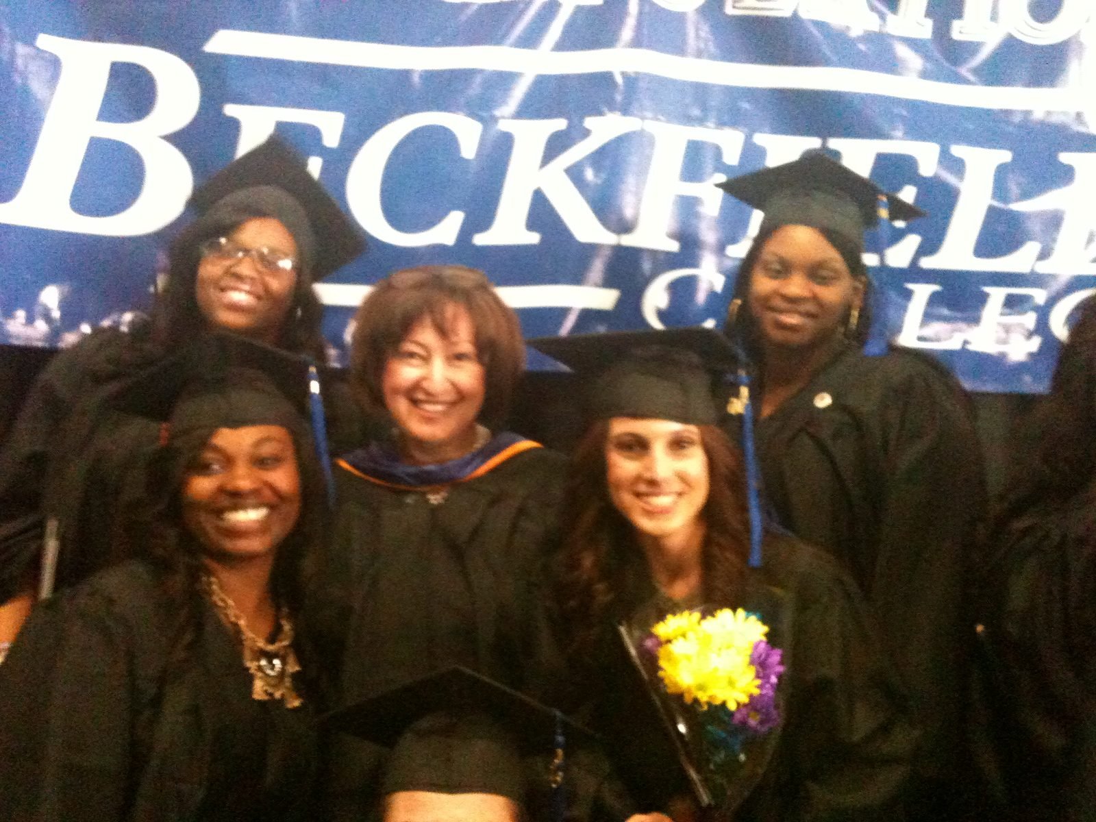 Marina Davar celebrating with dental assisting graduates at commencement